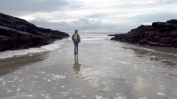 Lady Performing a Funny Dance on the Beach