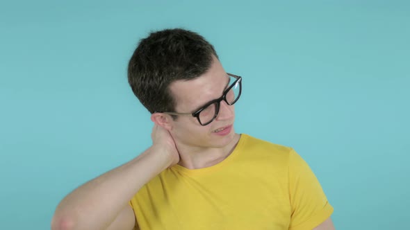 Man with Neck Pain, Blue Background