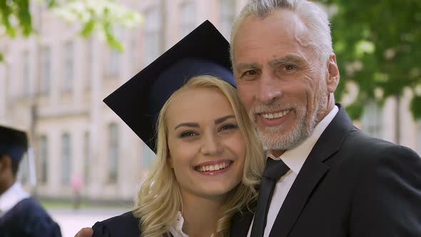 Happy Father Proud of His Clever Daughter Graduating From University With Honors