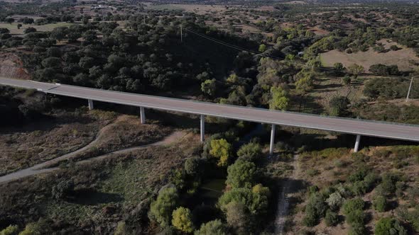 Modern elevated road near ancient roman bridge, Vila Formosa in Portugal. Aerial reverse