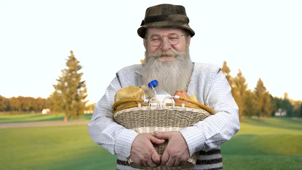 Senior Farmer Holding Basket of Dairy Products.