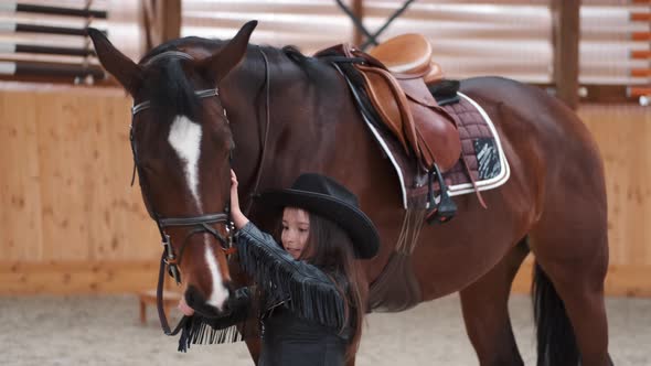 Beautiful Sports Girl Lead Her Saddle Horse