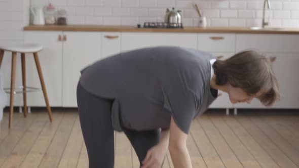 Young Woman Starts her Online Fitness Training