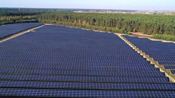 Aerial Drone Footage. Rise Up Flight Over Solar Panel Farm.