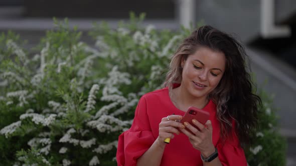 Young Woman is Communicating in Online Chat Using Smartphone for Sending Message