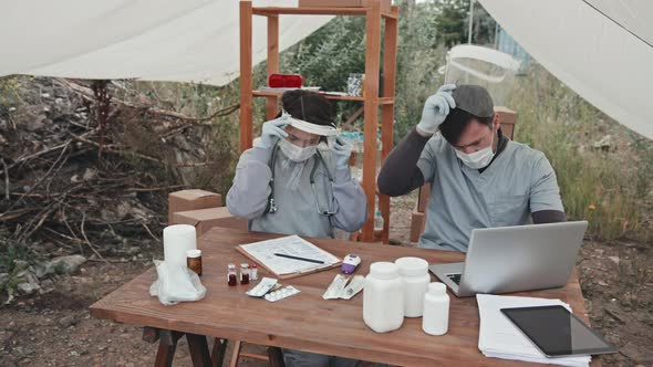 Tired Medical Workers at Refugee Camp