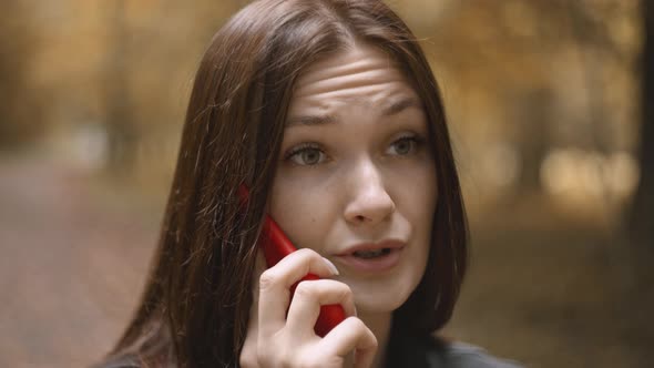 Woman with Long Hair Cute Talking on Mobile Phone with Parents in Autumn Forest