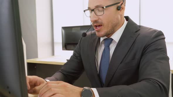 Business People Wearing Headset Working in Office