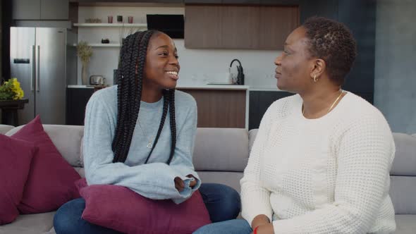 Caring Mother Soothing Troubled Teenage Daughter