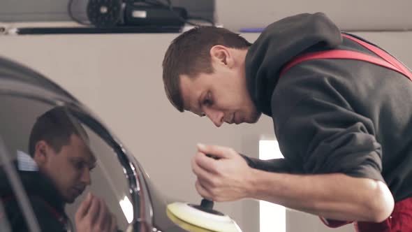 Polishing Black Car with a Professional Mashine