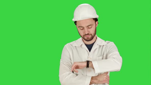 Construction Worker Looking at His Watch Builder Waiting for a Meeting on a Green Screen