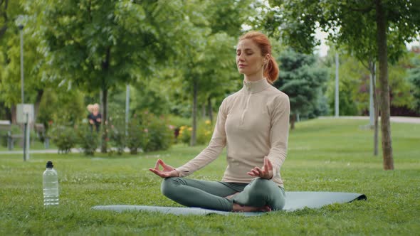 Young woman doing yoga in nature