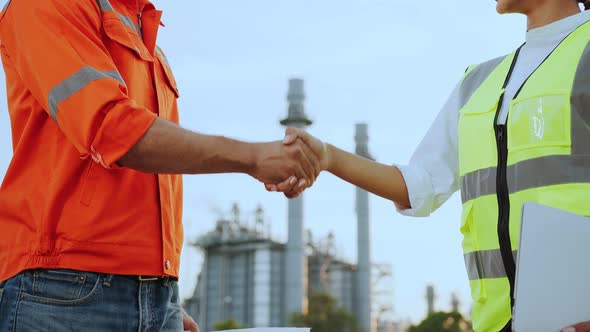 confident engineer and contractor successful business achievement hand shaking together