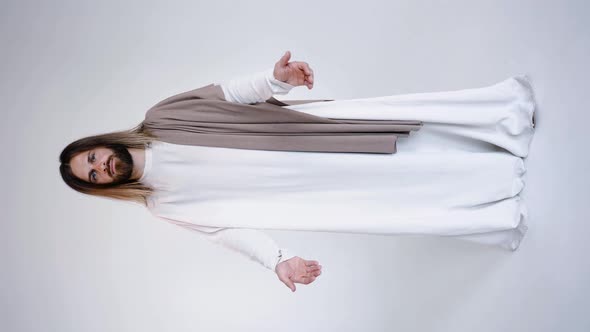 Jesus in Robe Spreads His Hands to the Sides Calling for Prayer