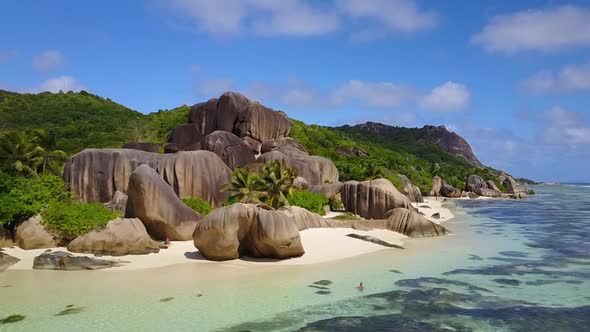 Aerial drone shot of the tropical and beautiful Anse Source D'argent beach in the Seychelles