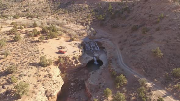 Flying in towards water fall on LaVerkin Creek viewing dirt road