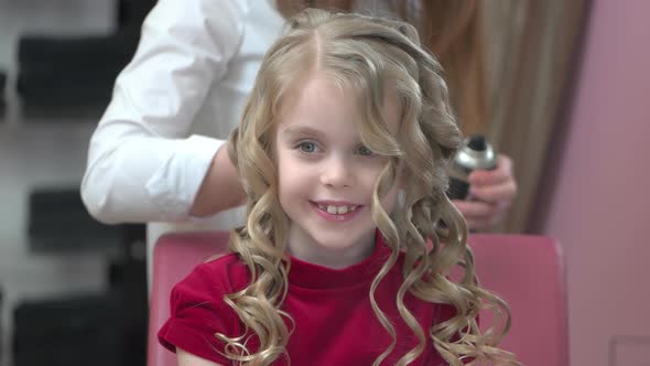 Little Girl at Hairdresser Smiling