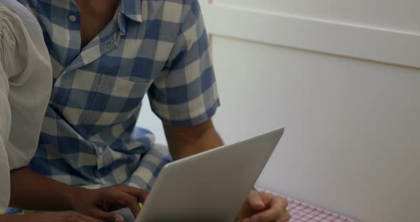 Young couple using laptop