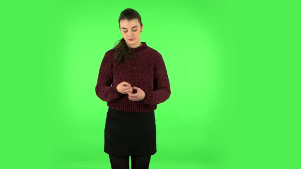 Girl Is Upset, Waving Her Hands in Indignation, Shrugs. Green Screen