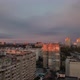 Purple Clouds in Grey Sky Over Cityscape in Golden Hour of Sunset - VideoHive Item for Sale