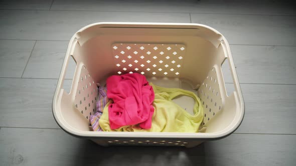 Pink Tshirt in a Stack of Light Linen