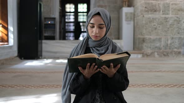Muslim Woman Reading Quran
