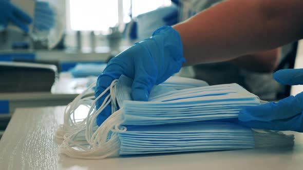 Medical Masks Are Getting Put Into Batches in a Close Up