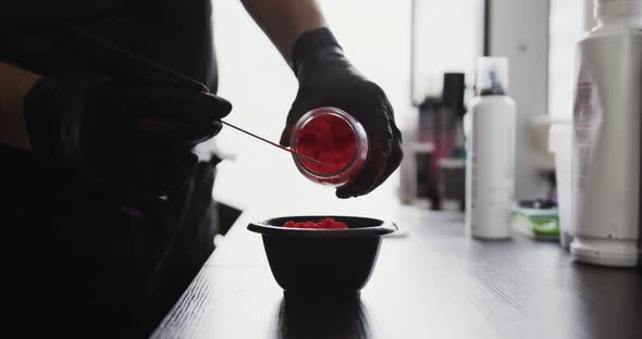 Close up view hairdresser mixing products