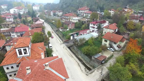 Poor City in Narrow Rocky Valley in Autumn