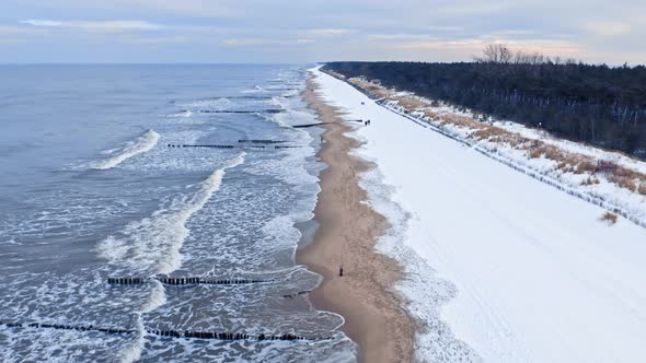 Snowy beach on Hel peninsula in winter. Winter Baltic Sea.