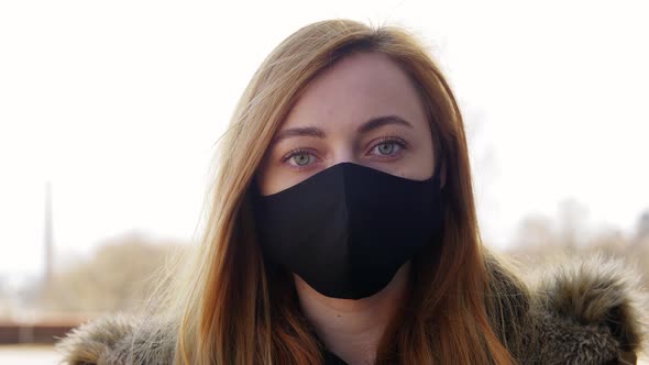 Woman Wearing Protective Reusable Barrier Mask