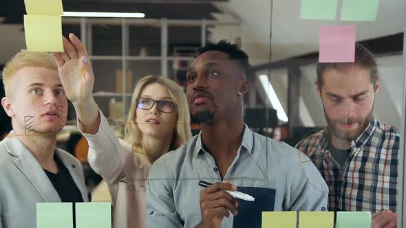 Men and One Pretty Light-Haired Female Colleague which Working with New Business Strategy