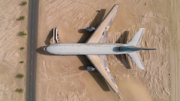 Aerial view above of museum airplane on desert landscape, Abu Dhabi, U.A.E