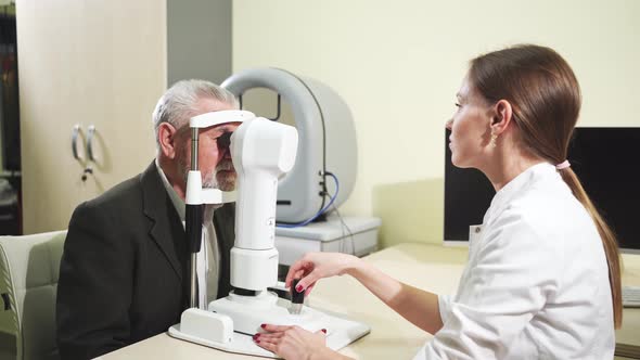 Ophthalmologist Examination of Elderly Man on Corneo Topographer