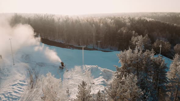 Aerial View Snow Cannon Sprays Water and Makes Snow