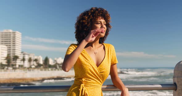 Woman combing her hair at beach