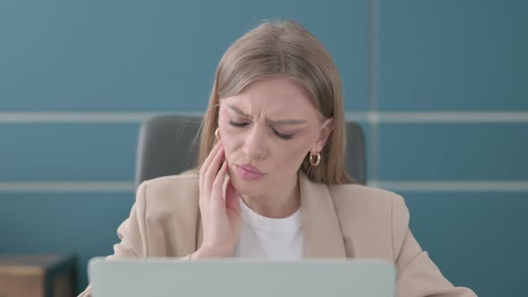 Close Up of Businesswoman Having Toothache While Using Laptop