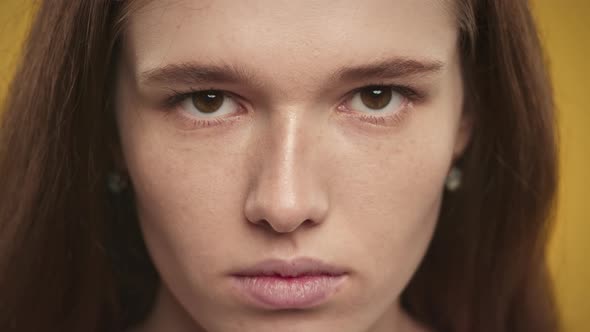 Caucasian Woman Raising Her Eyes Up on a Closeup Portrait in Slow Motion