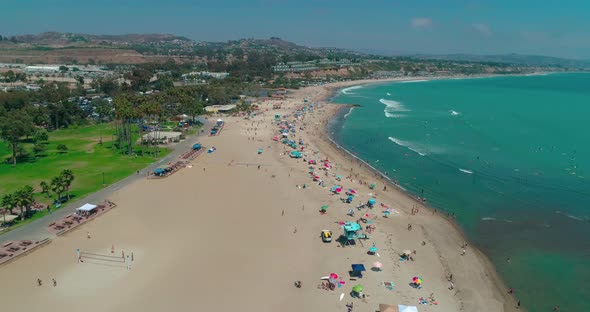 DANA POINT, California. Doheny State Beach. A Sunny Day Beach Scene with People Engaged in Beach