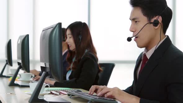 Business People Wearing Headset Working in Office