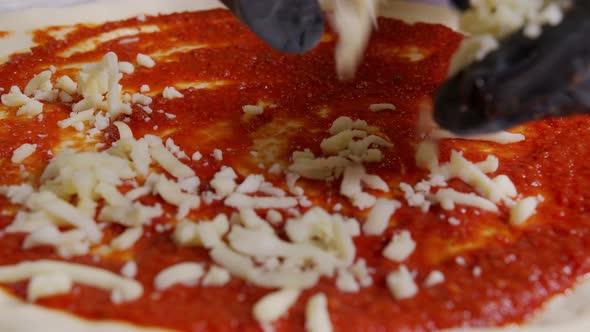 Close Up View of a Man Chef Cooking Italian Pizza. The Process of Making Pizza at Table . Fresh