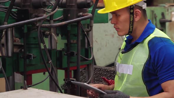 Smart Factory Worker Using Machine in Factory Workshop