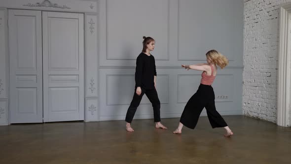 Young People are Performing Contemporary Choreography Man and Woman are Dancing in Hall