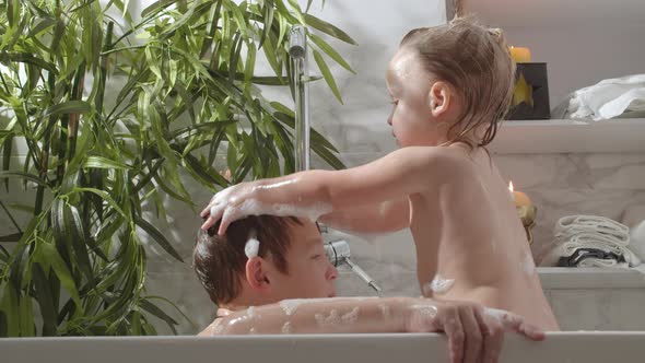 Children Bathing in Foamy Water