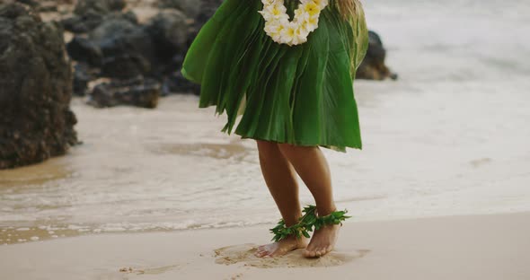 Woman performing Hawaiian hula on the beach