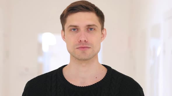 Portrait of Middle Aged Man Sitting in Office