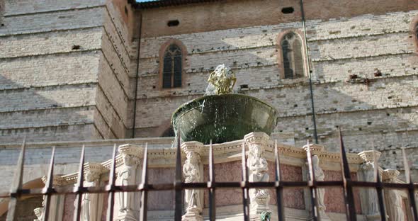 View Around Fountain in Main Square of Perugia, Umbria, Italy. Orbit Around Fountain Pouring Water