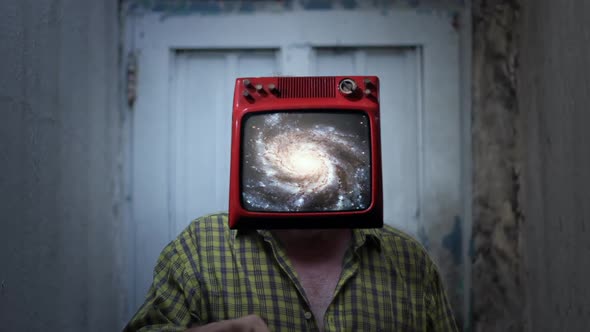 Man with Old TV on Head Showing a Spiral Galaxy on Screen.