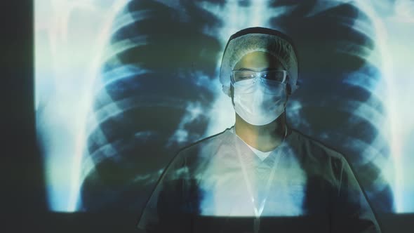 Middle Eastern Doctor in Mask Posing on Chest X-Ray