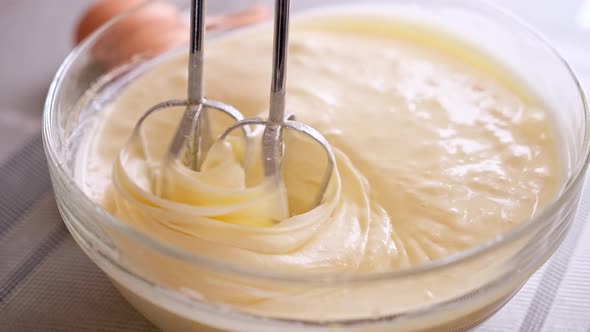 Closeup Person Preparing Homemade Omelette Beating Eggs with Mixer